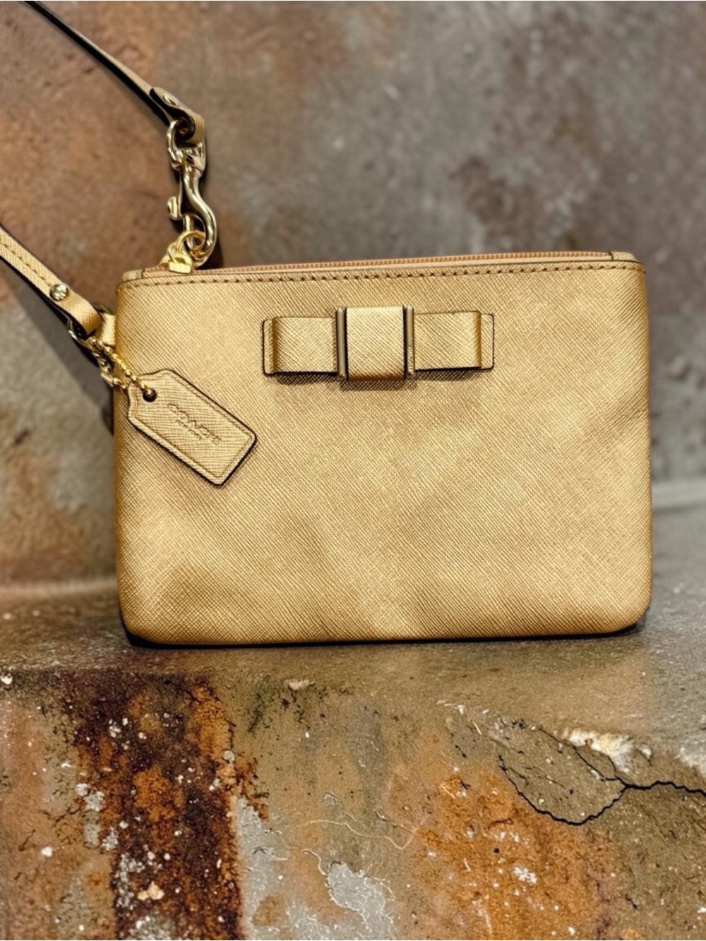 EUC - Coach Darcy Bow Wristlet Metallic Gold Saffiano Leather F51672